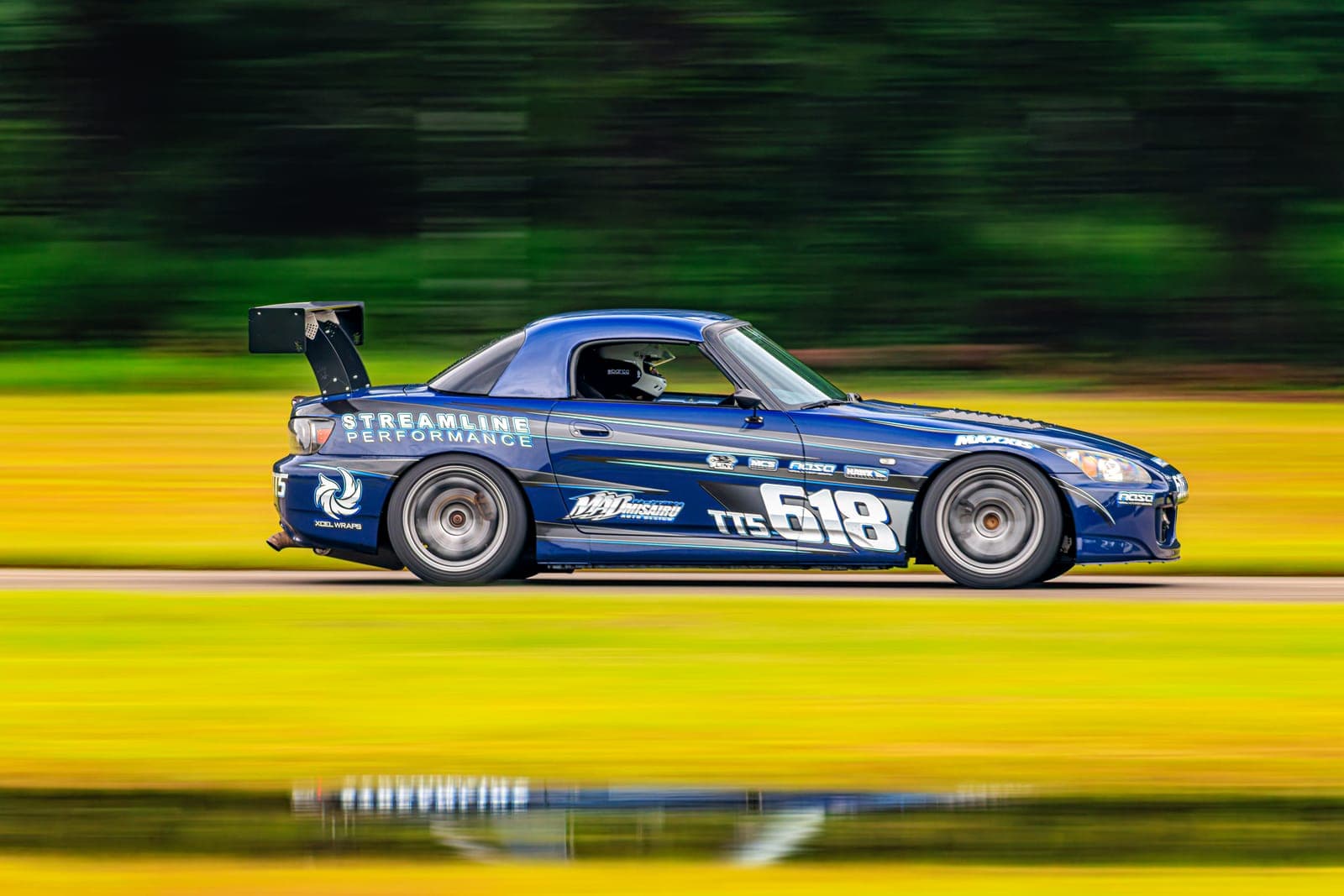 Blue Honda S2000 time attack car in Streamline Performance livery, number 618, at speed on a race track